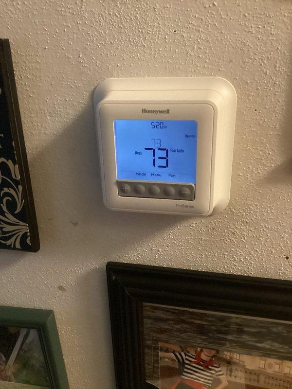 Responded to no heat call for 7-year-old Lennox furnace. Inspected system including thermostat (Honeywell ProSeries displaying 73°F on heat mode) and Trane humidifier mounted on ductwork. Diagnosed and restored proper heating operation.