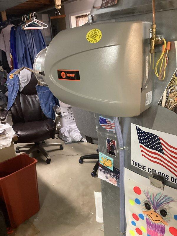 Responded to no heat call for 7-year-old Lennox furnace. Inspected system including thermostat (Honeywell ProSeries displaying 73°F on heat mode) and Trane humidifier mounted on ductwork. Diagnosed and restored proper heating operation.