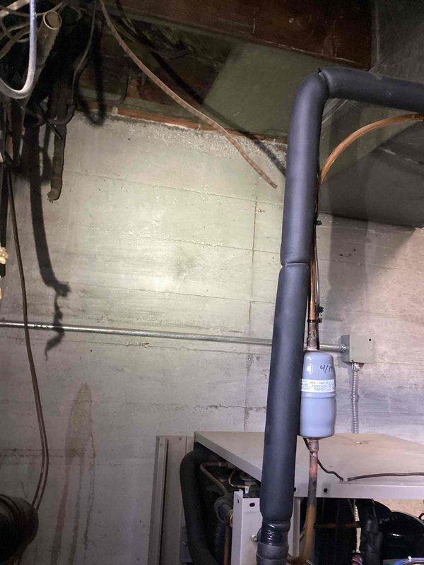 Responded to a non-operational geothermal system with reported thermal event on discharge line during cold weather. Inspection revealed damaged insulation on the main vertical pipe and compromised filter assembly. Replaced filter element, repaired pipe insulation, and restored system functionality after verifying proper operation of all components.