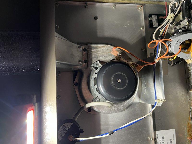 Performed diagnostic service on 10+ year old furnace located in basement that was reported as not running sufficiently. Inspection revealed dust accumulation and minor corrosion within the blower assembly. After cleaning components and testing electrical connections, confirmed proper operation with SC260 meter showing acceptable readings of 19 on relevant components. System now functioning correctly with normal cycle times.