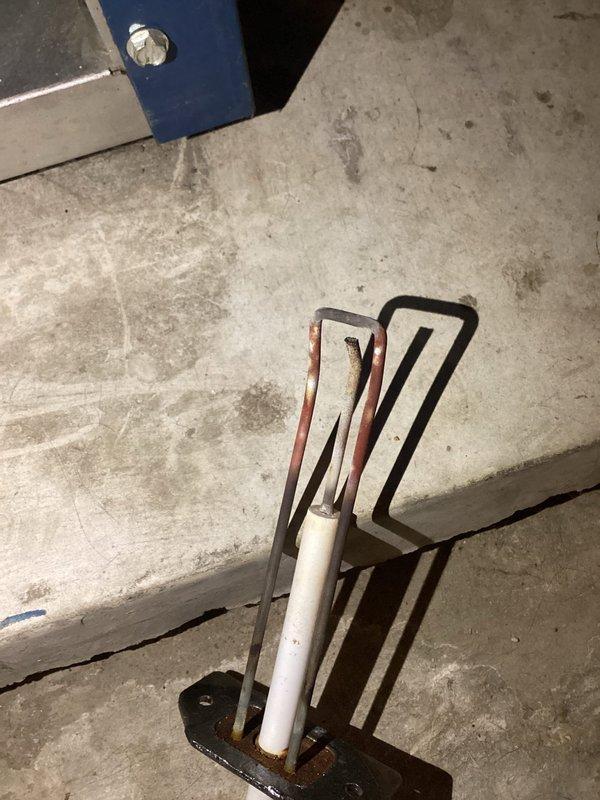 Responded to no-heat call after previous service visit where customer reported E02 error code on 16-year-old basement boiler. Diagnosed failed expansion tank and mounting bracket showing significant corrosion. Replaced expansion tank, purged air from system, and verified proper system pressure using hydrostatic gauge. Unit now operating within normal parameters with error code cleared.