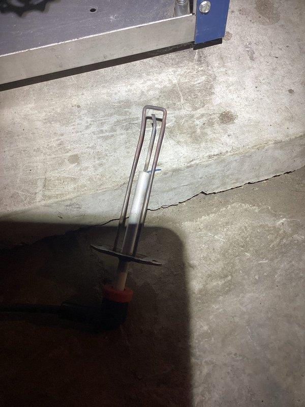 Responded to no-heat call after previous service visit where customer reported E02 error code on 16-year-old basement boiler. Diagnosed failed expansion tank and mounting bracket showing significant corrosion. Replaced expansion tank, purged air from system, and verified proper system pressure using hydrostatic gauge. Unit now operating within normal parameters with error code cleared.