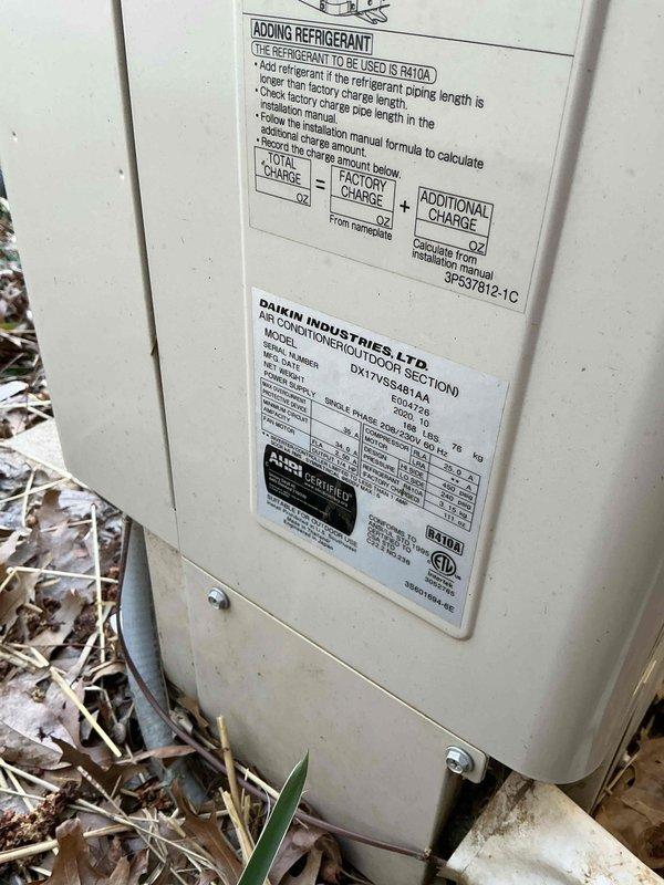 Performed annual preventative maintenance tune-up on 2021 Daikin AC unit located in basement. Inspected system components, cleaned visible debris from condenser coil, and verified proper operation of R410A refrigerant system according to manufacturer specifications. Unit is functioning properly with no issues identified.