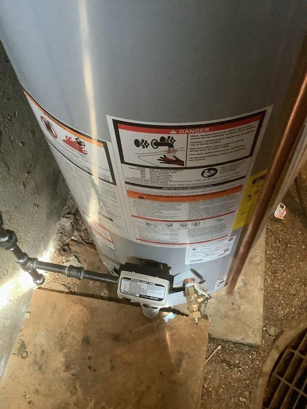 Successfully installed a new 40-gallon short gas water heater in basement utility area, complete with proper copper pipe connections and expansion tank. Installation was performed according to local code requirements, with all safety features verified and system tested for proper operation.