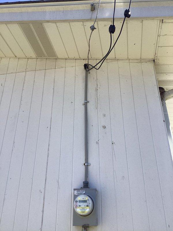 Performed a comprehensive electrical inspection of the residence, examining the exterior electrical service entrance with meter and conduit system, and evaluating the interior circuit breaker panel. Panel inspection revealed properly installed breakers with appropriate labeling on the directory. All electrical components appeared functional with no immediate safety concerns identified.