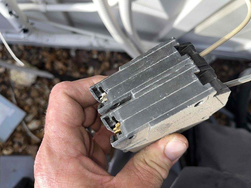 Responded to service call for non-functioning mini split in kitchen area. Diagnosed faulty electrical relay/connector with visible wear and dust accumulation. Checked circuit breaker panel, which showed power to the unit, and replaced damaged component to restore system operation.