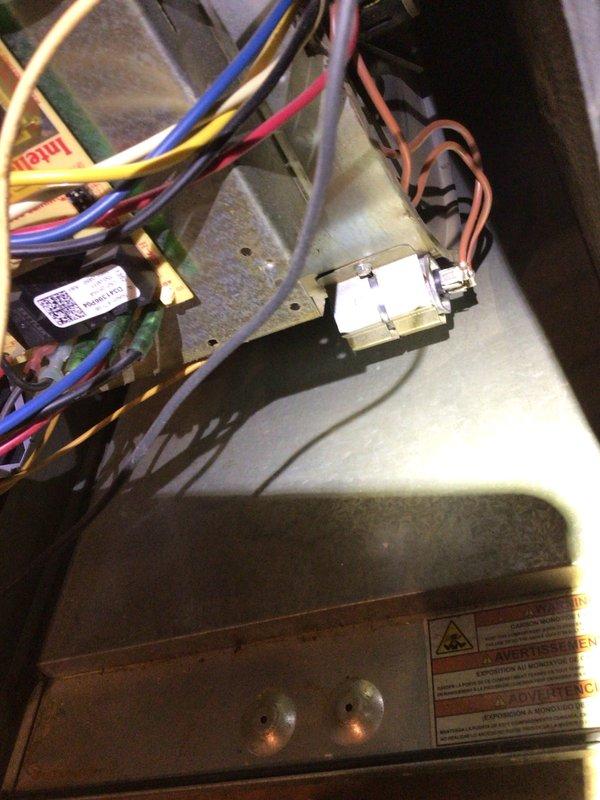 Performed routine cooling maintenance on a 12-year-old AC system that was functioning properly. Inspected electrical components including wiring connections and terminal blocks in the control panel. Examined refrigerant lines and mechanical components in the utility area, confirming proper installation and condition of copper piping and mounting brackets.