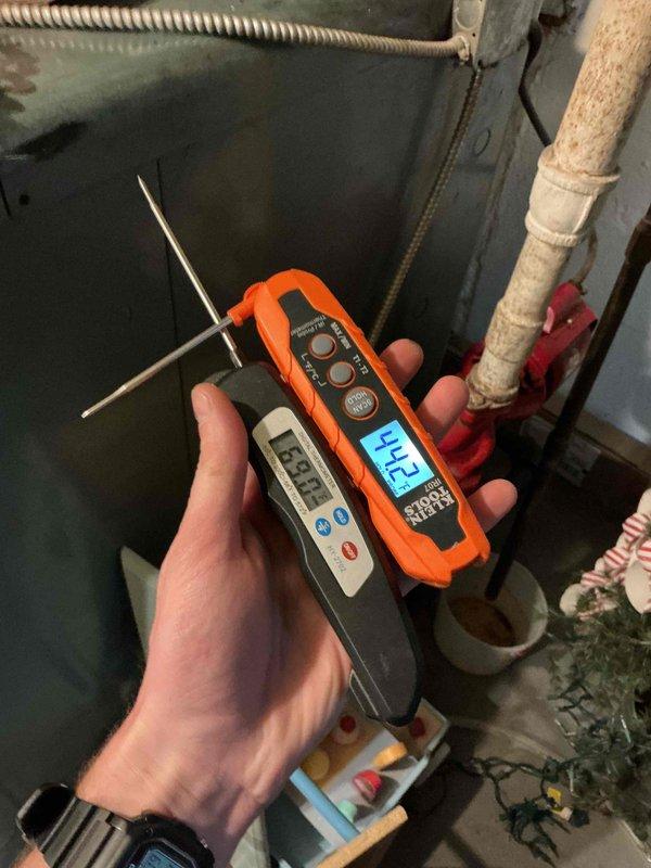 Performed scheduled seasonal tune-up service on two outdoor cooling units (side of home). Conducted comprehensive diagnostic testing including temperature differential measurements (188°F/212°F readings observed) and refrigerant pressure checks using manifold gauges. Both condensers were inspected, cleaned of debris accumulation, and verified for proper operation with all components functioning within manufacturer specifications.