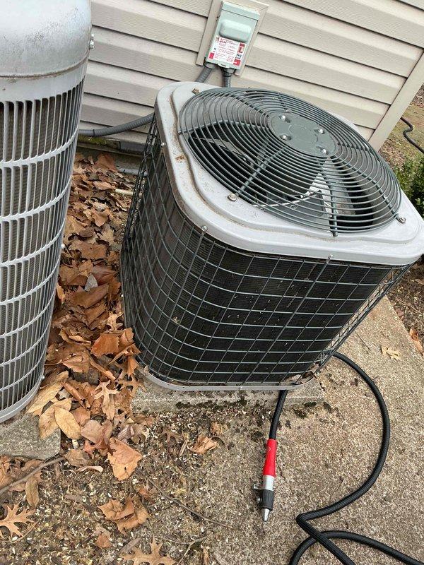 Performed scheduled seasonal tune-up service on two outdoor cooling units (side of home). Conducted comprehensive diagnostic testing including temperature differential measurements (188°F/212°F readings observed) and refrigerant pressure checks using manifold gauges. Both condensers were inspected, cleaned of debris accumulation, and verified for proper operation with all components functioning within manufacturer specifications.