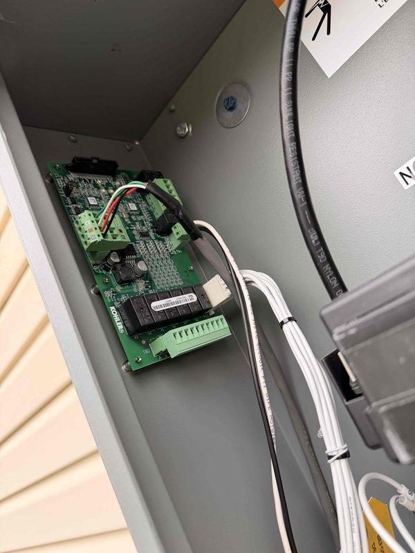 Conducted a free electrical inspection service, examining the exterior utility meter and interior control panel. Meter was found properly installed with no visible damage, displaying normal readings with proper connections to the electrical system. Interior control panel inspection revealed a properly mounted circuit board with intact relays, terminal blocks, and appropriately secured wiring connections.
