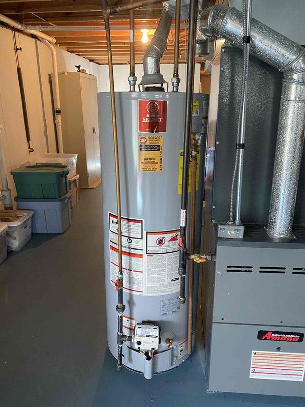 Successfully installed a new 75-gallon gas tall water heater in the basement utility room, properly connecting all required plumbing and venting components to existing systems. Completed installation of customer-supplied shower head in second floor primary suite. Applied permit identification sticker #26PLU-05133 as required.