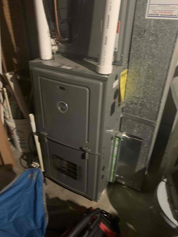 Performed annual heating tune-up on 7-year-old furnace located in basement. Inspected and confirmed proper operation of Nest thermostat and verified heating cycle functionality. Examined furnace unit including PVC exhaust venting, ductwork connections, and all safety systems - all components operating within normal parameters.