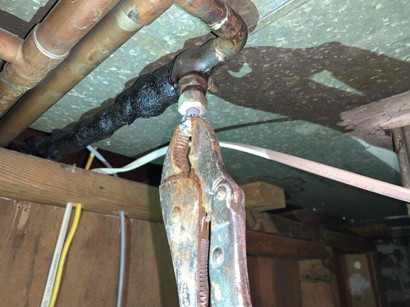 Completed main drain cleanout service to address slow drainage issues caused by root intrusion in the lateral sewer line. Inspection revealed significant corrosion on copper pipes in the basement/crawlspace area, particularly at pipe joints where deterioration was most severe. Successfully cleared blockage and restored proper flow to the system.