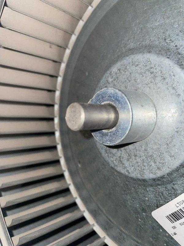 Performed tune-up service on two cooling units under 10 years old, both located at ground level on side yard. Inspected furnace system with connected ductwork and examined blower wheel assembly for proper operation, noting normal dust accumulation but overall functional condition.