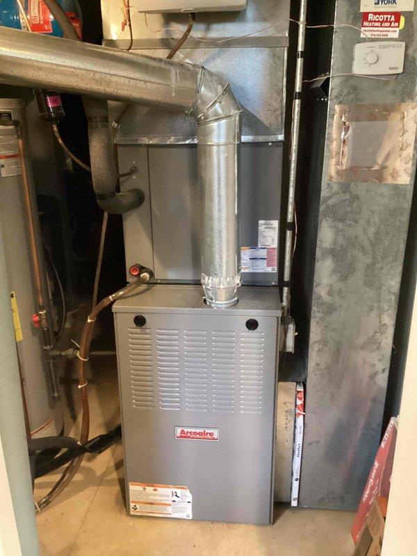 Performed annual cooling maintenance on 11-year-old Arcoaire HVAC system. Inspected outdoor condenser unit and indoor furnace components, confirming proper operation and connections. System is functioning correctly with no issues identified during the comprehensive tune-up service.