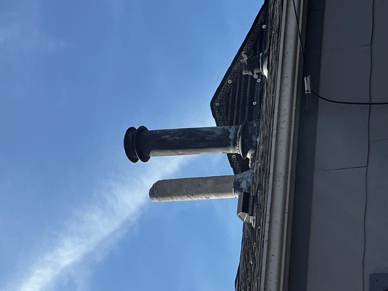 Responded to service call for dislodged flue pipe on roof. Inspection revealed significant corrosion at duct connection point in utility area, indicating moisture damage and system deterioration. Successfully reattached flue pipe and secured ventilation system to prevent future displacement.