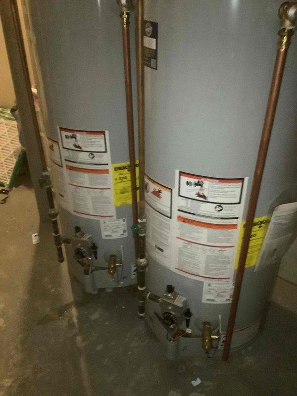 Successfully installed two 50-gallon gas tall water heaters with 1" PRV according to permitted specifications (Permit #26PLU-05178; 26PLU-05179). System includes a properly mounted expansion tank with copper piping connections. Applied required identification stickers to each unit and completed all necessary plumbing connections with appropriate valves per code requirements.