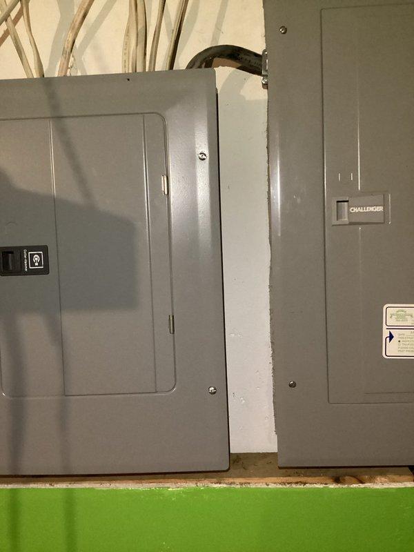 # Electrical Maintenance - Home Audit Summary

Completed comprehensive electrical inspection of residential service panels and distribution system. Documented existing electrical infrastructure including main panel configuration with dual-row circuit breaker arrangement and secondary Challenger-brand panel installation. Assessed wire management, bus bar connections, and overall system integrity. Photographed panel interiors showing wire routing, breaker distribution, and termination points for service records. Verified proper panel accessibility and documented current system configuration for homeowner reference.