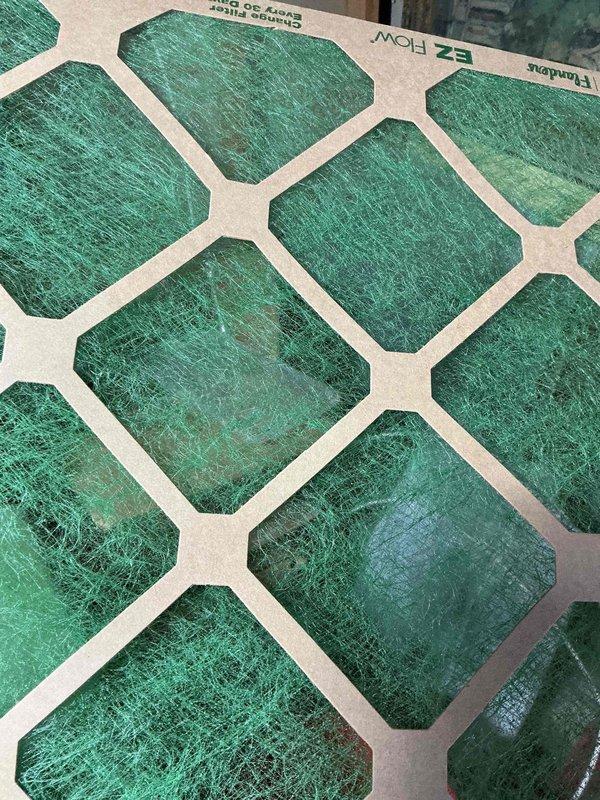 # HVAC Service Report - Cooling System Tune-Up

Completed comprehensive cooling system tune-up on residential air conditioning unit (under 10 years old) located in backyard area. Performed standard maintenance protocol including system inspection, filter evaluation, and operational testing to ensure optimal performance for the cooling season.

## Service Activities Performed

**System Inspection & Component Check:**
- Conducted visual inspection of outdoor condensing unit and associated components
- Examined refrigerant lines and insulation integrity
- Inspected electrical connections and wiring for signs of wear or damage
- Verified proper mounting and structural stability of unit

**Filter Assessment:**
- Evaluated air filter condition (EZ Flow/Flanders brand with honeycomb pattern design)
- Documented filter media appearance showing teal-colored fibrous material
- Noted filter operational status for maintenance records

**Mechanical Components:**
- Inspected compressor assembly and 