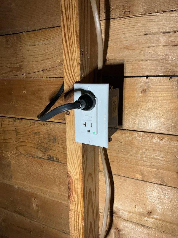 # Service Report

Responded to service call for non-functional outlet at circuit 59AJ in 8-12 location. Upon inspection, identified defective duplex receptacle in unfinished utility space with exposed framing. Replaced faulty outlet with new standard duplex receptacle, verified proper wire connections to black electrical cable, and confirmed secure mounting to wooden stud. Tested circuit functionality with plug-in device to ensure proper power delivery to both receptacle positions. Outlet restored to full working condition and passed operational testing.