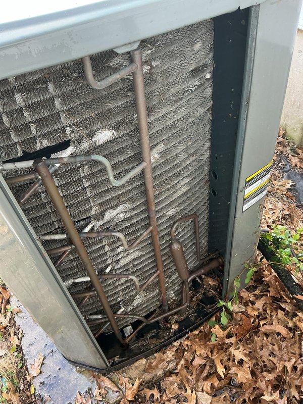 # Service Report: HVAC Supertune Maintenance

Completed comprehensive supertune maintenance on an 18-year-old split system consisting of an outdoor air conditioning condenser and indoor gas furnace. Upon arrival, performed thorough inspection of both units to assess overall system condition and identify any immediate concerns.

## Air Conditioning Unit

Inspected outdoor condenser unit and found significant accumulation of dirt, debris, and organic matter on condenser coils and throughout cabinet. Coil fins were heavily soiled, restricting airflow and reducing heat transfer efficiency. Removed access panels and cleared leaf litter and debris from base of unit and surrounding area. Cleaned condenser coils using appropriate methods to restore proper airflow through fins. Inspected refrigerant lines for signs of damage, corrosion, or leaks—copper lines showed age-appropriate wear but remained intact. Checked electrical connections and capacitor. Verified compressor operation and monitored