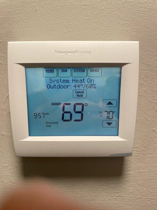 # Service Report: No Cool Call

Responded to no cool call on 2-year-old ground-level unit located in basement. Upon arrival, customer reported unit not turning on. Performed system diagnostics and found thermostat was set to heating mode instead of cooling mode. Verified outdoor temperature at 44°F with system attempting to operate in heat mode. Switched thermostat system setting from "Heat" to "Cool" mode and adjusted temperature setpoint from 70°F to 73°F to initiate cooling cycle. Confirmed thermostat display properly showing "System: Cool" status and unit responding to commands. Verified all thermostat functions operating correctly including temperature adjustment controls, hold settings, and system mode selection. System now cycling properly in cooling mode with accurate temperature readings displayed. No mechanical or electrical issues identified with HVAC equipment. Educated customer on proper thermostat operation and system mode selection for seasonal changes. Unit left in prop