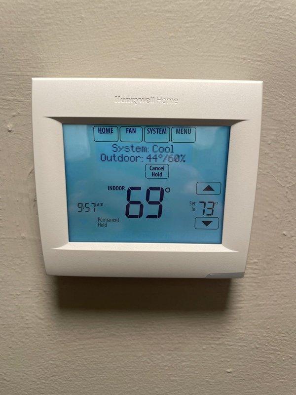 # Service Report: No Cool Call

Responded to no cool call on 2-year-old ground-level unit located in basement. Upon arrival, customer reported unit not turning on. Performed system diagnostics and found thermostat was set to heating mode instead of cooling mode. Verified outdoor temperature at 44°F with system attempting to operate in heat mode. Switched thermostat system setting from "Heat" to "Cool" mode and adjusted temperature setpoint from 70°F to 73°F to initiate cooling cycle. Confirmed thermostat display properly showing "System: Cool" status and unit responding to commands. Verified all thermostat functions operating correctly including temperature adjustment controls, hold settings, and system mode selection. System now cycling properly in cooling mode with accurate temperature readings displayed. No mechanical or electrical issues identified with HVAC equipment. Educated customer on proper thermostat operation and system mode selection for seasonal changes. Unit left in prop