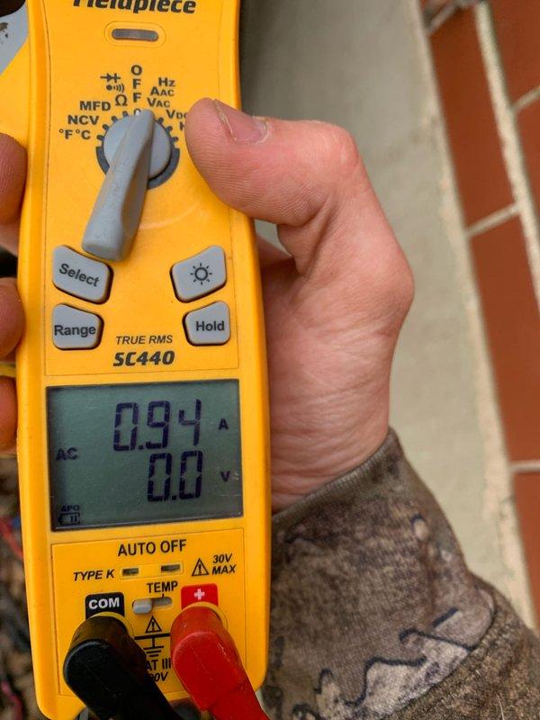 # HVAC Maintenance - Cooling U10 Service Report

Responded to service call for 16-year-old cooling system with reported constant runtime and non-functional outdoor fan. Upon arrival, performed diagnostic evaluation of the outdoor condensing unit located at ground level.

Conducted electrical diagnostics using clamp meter to measure amperage draw on system components. Initial readings revealed condenser fan motor drawing 0.94 amps, indicating insufficient current flow for proper motor operation. Further testing confirmed compressor amperage at 7.34 amps while outdoor fan remained inoperative.

Diagnosis determined outdoor condenser fan motor failure as primary cause of reported symptoms. Non-functional fan motor prevented adequate heat rejection from condenser coil, resulting in extended system runtime and reduced cooling efficiency. Compressor continued operating under elevated head pressure conditions due to inadequate airflow across condenser coil.

Presented findings and repair reco