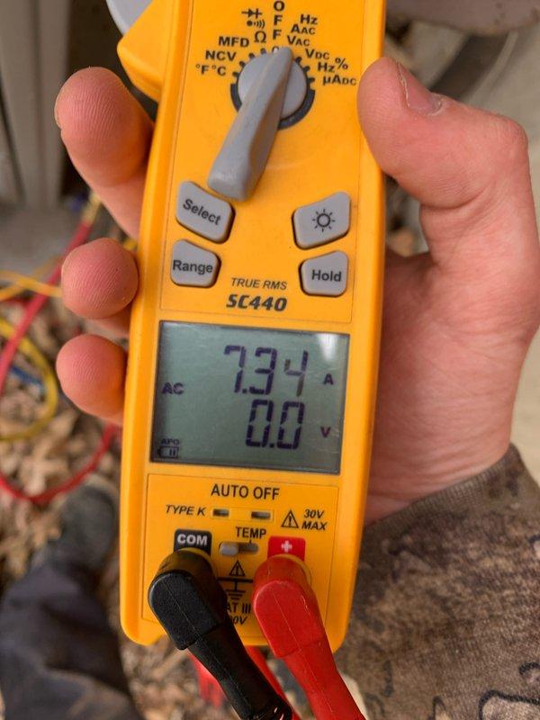 # HVAC Maintenance - Cooling U10 Service Report

Responded to service call for 16-year-old cooling system with reported constant runtime and non-functional outdoor fan. Upon arrival, performed diagnostic evaluation of the outdoor condensing unit located at ground level.

Conducted electrical diagnostics using clamp meter to measure amperage draw on system components. Initial readings revealed condenser fan motor drawing 0.94 amps, indicating insufficient current flow for proper motor operation. Further testing confirmed compressor amperage at 7.34 amps while outdoor fan remained inoperative.

Diagnosis determined outdoor condenser fan motor failure as primary cause of reported symptoms. Non-functional fan motor prevented adequate heat rejection from condenser coil, resulting in extended system runtime and reduced cooling efficiency. Compressor continued operating under elevated head pressure conditions due to inadequate airflow across condenser coil.

Presented findings and repair reco