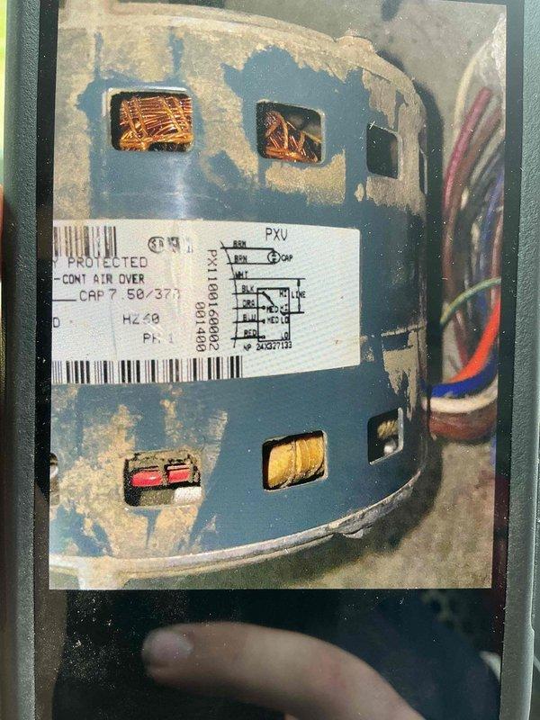 # Service Report: Blower Motor Replacement

Replaced failed blower motor in HVAC system. Upon arrival, removed access panels to access blower compartment and disconnected electrical connections from defective motor assembly. Removed old motor showing significant wear, corrosion, and deterioration on contactor unit and internal components. Installed new replacement blower motor, reconnected all electrical wiring per manufacturer specifications, and verified proper wire routing. Tested system operation to confirm motor functionality and proper airflow. Removed and disposed of old motor assembly per standard procedures. System restored to normal operation.
