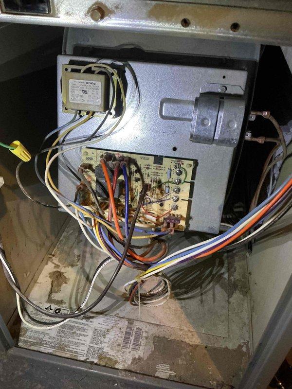 # Service Report: Blower Motor Replacement

Replaced failed blower motor in HVAC system. Upon arrival, removed access panels to access blower compartment and disconnected electrical connections from defective motor assembly. Removed old motor showing significant wear, corrosion, and deterioration on contactor unit and internal components. Installed new replacement blower motor, reconnected all electrical wiring per manufacturer specifications, and verified proper wire routing. Tested system operation to confirm motor functionality and proper airflow. Removed and disposed of old motor assembly per standard procedures. System restored to normal operation.