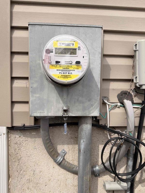 # Electrical Maintenance - Home Audit Summary

Completed comprehensive free electrical inspection of residential property. Documented exterior electrical service entrance including MILBANK meter enclosure with digital display and associated conduit system, as well as interior main electrical panel containing approximately 16-20 circuit breakers with integrated surge protection device. All components photographed for service records; system appears functional with standard weathering on exterior equipment.

# Detailed Service Description

Performed thorough electrical safety inspection of residential electrical system as scheduled. Inspection focused on two primary areas: the exterior electrical service entrance and the interior main distribution panel.

**Exterior Service Entrance Inspection:**
Examined and documented the main electrical meter installation mounted on exterior wall with horizontal siding. The MILBANK-branded gray metallic meter enclosure houses a digital LCD meter displ