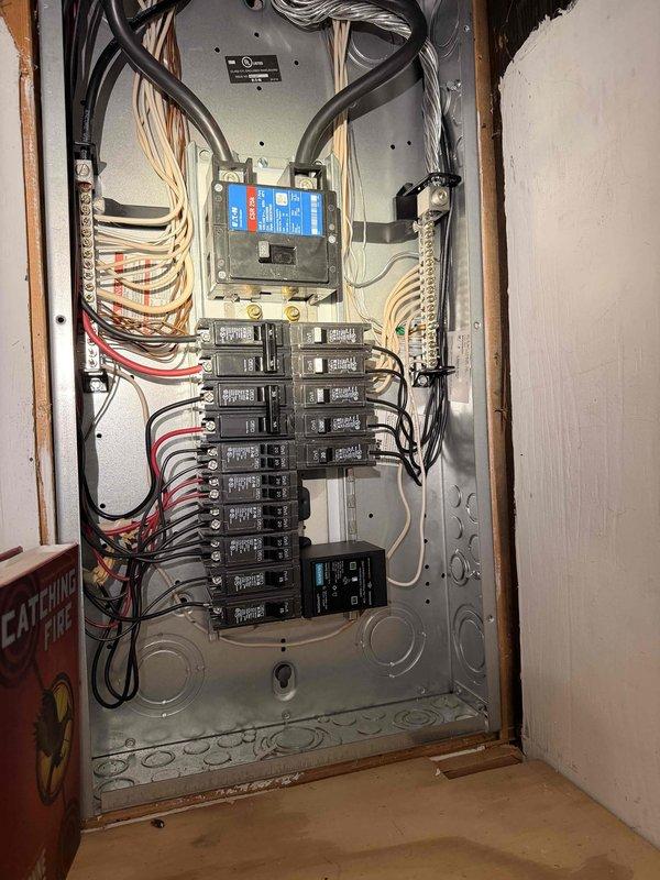 # Electrical Maintenance - Home Audit Summary

Completed comprehensive free electrical inspection of residential property. Documented exterior electrical service entrance including MILBANK meter enclosure with digital display and associated conduit system, as well as interior main electrical panel containing approximately 16-20 circuit breakers with integrated surge protection device. All components photographed for service records; system appears functional with standard weathering on exterior equipment.

# Detailed Service Description

Performed thorough electrical safety inspection of residential electrical system as scheduled. Inspection focused on two primary areas: the exterior electrical service entrance and the interior main distribution panel.

**Exterior Service Entrance Inspection:**
Examined and documented the main electrical meter installation mounted on exterior wall with horizontal siding. The MILBANK-branded gray metallic meter enclosure houses a digital LCD meter displ