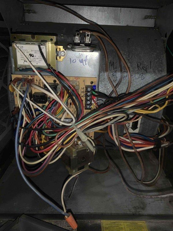 # Service Report: HVAC Tune-Up U10 - Cooling

## Summary
Responded to service call for air conditioning unit not producing cool air. Performed comprehensive cooling system tune-up and diagnostic evaluation on outdoor condensing unit located on side of residence.

## Work Performed

**System Inspection:**
Conducted visual inspection of outdoor condensing unit and accessed electrical control panel for diagnostic assessment. Unit showed signs of age with previous service history noted by handwritten markings inside control compartment indicating prior capacitor replacement (10 µF notation visible).

**Electrical Component Evaluation:**
Opened and inspected electrical control panel revealing multiple wire connections to contactor, control board, and associated circuits. Evaluated condition of wiring harnesses, contactor operation, and control module functionality. Assessed electrical connections for proper termination and signs of heat damage or deterioration.

**Cooling System Diagnostics