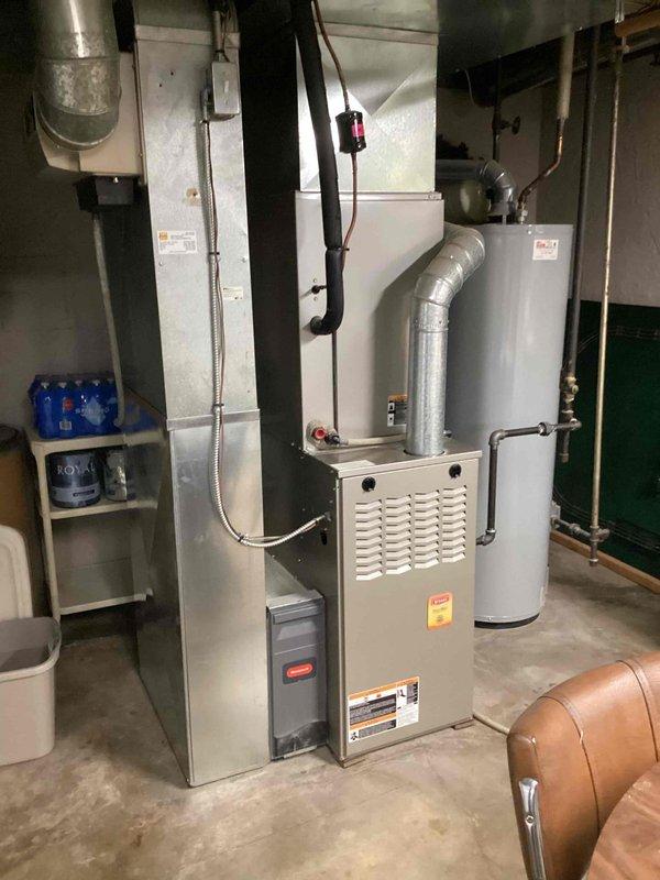 # Service Summary

Responded to service call for reported thermostat malfunction on residential HVAC system. Performed diagnostic evaluation of single-unit system located in basement mechanical room.

# Work Performed

Upon arrival, conducted comprehensive system assessment including thermostat functionality testing, control wiring inspection, and communication verification between thermostat and air handler unit. Examined furnace/air handler installation with overhead ductwork configuration. Verified proper electrical connections at equipment and thermostat location. Tested thermostat display, temperature sensing capability, and call functions for both heating and cooling modes.

Inspected air handler cabinet, control board, and associated low-voltage wiring for any signs of damage, loose connections, or component failure. Checked transformer output voltage to ensure adequate power supply to thermostat. Evaluated system response to temperature adjustments and mode changes at thermosta