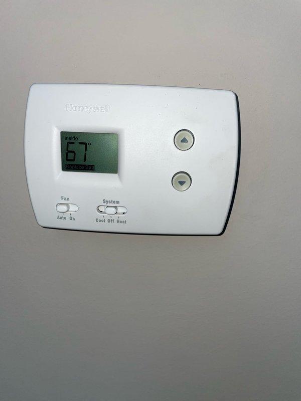 Responded to no cooling complaint on 9-year-old residential air conditioning system. Upon arrival, found thermostat set to cooling mode at 67°F but unit not operating. Inspected outdoor condensing unit and discovered electrical compartment heavily contaminated with dirt, dust, debris, and cobwebs throughout wiring and components. Checked capacitor, contactor, and electrical connections - all connections secure but components compromised by excessive debris accumulation. Cleaned electrical panel, removed contamination from wiring harnesses and component surfaces, and verified proper electrical function. Tested system operation - unit now cooling properly with normal temperature differential across coil. Advised homeowner of importance of regular maintenance to prevent future debris-related failures.