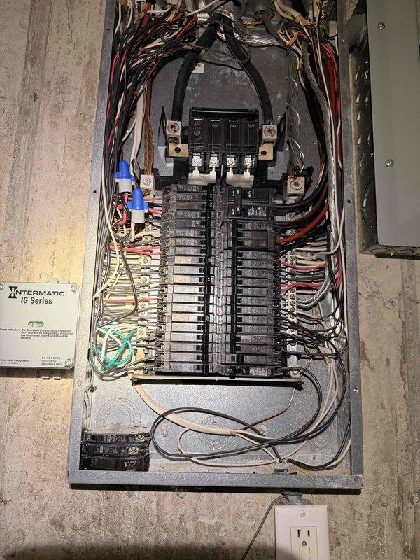 Installed Intermatic RC Series surge protection device in main electrical panel. Connected surge protector to panel bus bars and verified proper grounding and circuit integration with existing breaker configuration.
