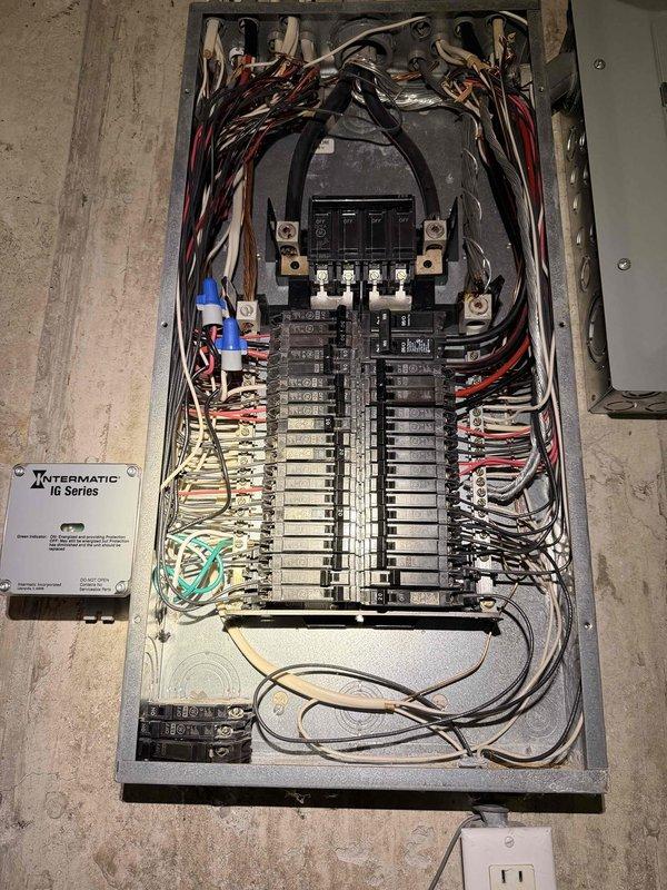 Installed Intermatic RC Series surge protection device in main electrical panel. Connected surge protector to panel bus bars and verified proper grounding and circuit integration with existing breaker configuration.