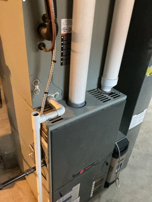 Responded to no cooling complaint on residential split system air conditioning unit over 10 years old located on side of home. Upon arrival, confirmed system was running but not producing cold air. Performed diagnostic evaluation of furnace/air handler and outdoor condensing unit. Identified failed compressor preventing refrigerant circulation through system. Discussed repair options and recommended compressor replacement. Customer approved necessary repairs to restore cooling operation to the system.