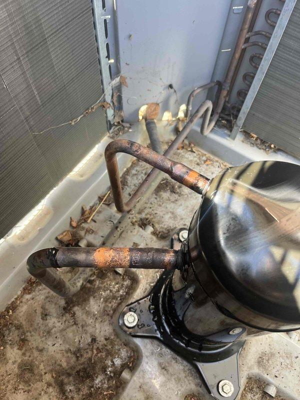 Replaced failed compressor and installed two 40-amp fuses in the disconnect box. Performed comprehensive system diagnostics to identify the root cause of compressor failure, which revealed significant corrosion on copper refrigerant lines and accumulated debris in the condensing unit. Implemented corrective measures to prevent premature failure of the replacement compressor and retained the original failed component for warranty documentation.