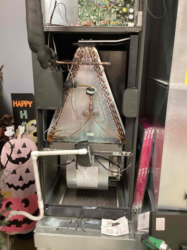 Responded to service call for frozen evaporator coil on 6-year-old mini-split system serving south side of residence. Connected manifold gauge set to outdoor condenser unit to measure refrigerant pressures and system performance parameters. Upon inspection of indoor air handler unit, assessed internal components including blower assembly, refrigerant lines, electrical connections, and evaporator coil condition to diagnose cause of freezing issue.