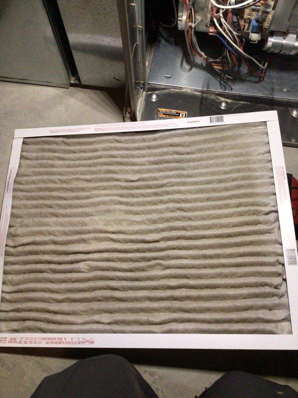 Completed comprehensive tune-up service on two HVAC systems located in basement with raised installations per Home Depot work order #F57809763. Performed full system inspection including control board evaluation, electrical connections check, and burner assembly examination on both units. Documented heavily soiled air filter requiring replacement due to significant dust and debris accumulation restricting airflow, which was affecting system efficiency and indoor air quality.