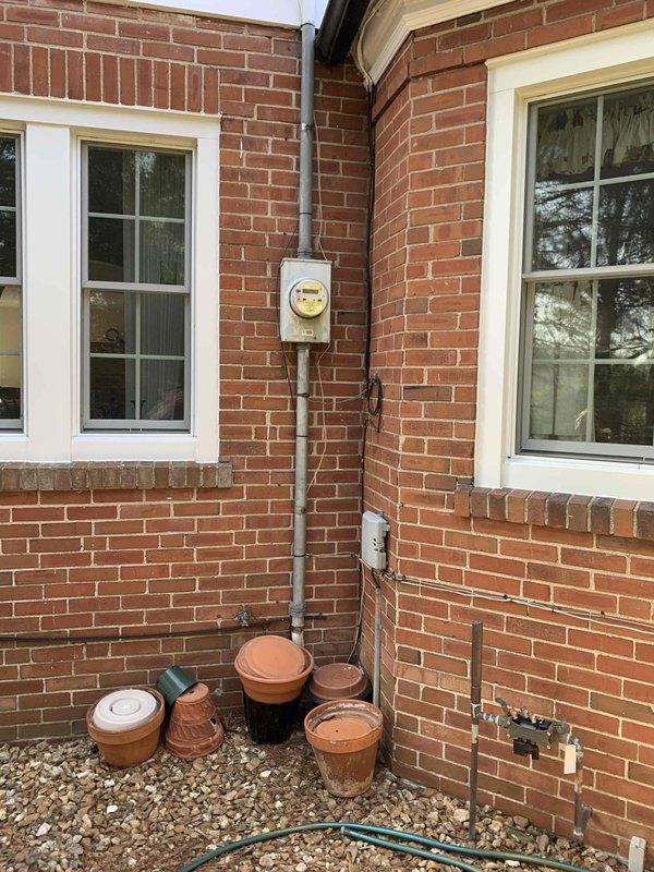 Completed comprehensive electrical inspection of residential property including exterior service entrance and main electrical panel. Inspected exterior meter base installation, service conduit routing, and weatherhead connections for proper code compliance and physical condition. Evaluated main electrical panel in basement area, documenting circuit breaker configuration, panel loading, and proper identification of circuits. Photographed electrical service equipment and panel interior for record-keeping purposes. All observed components were documented for homeowner review as part of complimentary electrical safety audit.