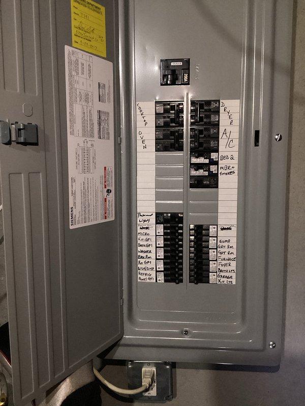 Completed comprehensive electrical inspection of residential service panel and outlet systems. Documented main breaker panel configuration with multiple circuits serving A/C unit, bedrooms, water heater, and garage, verifying proper labeling and breaker functionality. Performed outlet testing using digital circuit analyzer to assess grounding, polarity, and wiring integrity throughout accessible areas of the home.