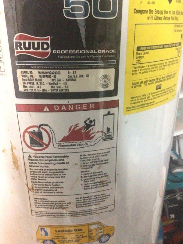Installed a new 50-gallon tall gas water heater manufactured by RUUD in the mechanical room. Connected copper supply and discharge piping to the unit, ensuring proper integration with existing plumbing infrastructure. Applied permit identification sticker for permit #26PLU-05454 and verified all warning labels, energy guide information, and manufacturer specifications were clearly visible on the installed unit.