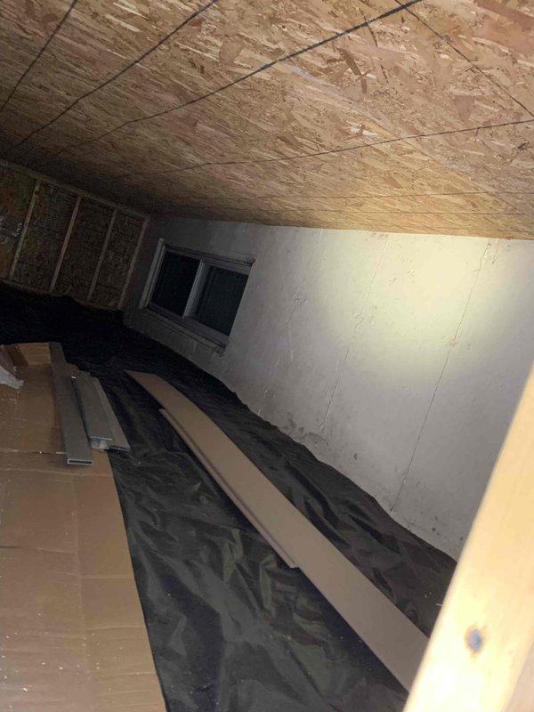 Completed comprehensive electrical safety inspection of residential property. Evaluated attic electrical systems, examining wiring conditions within unfinished crawl space area with exposed joists and insulation, and inspected exterior electrical service equipment including utility meter box, conduit routing, and weatherhead connections mounted on building exterior wall. Documented findings with photographic evidence for homeowner records.