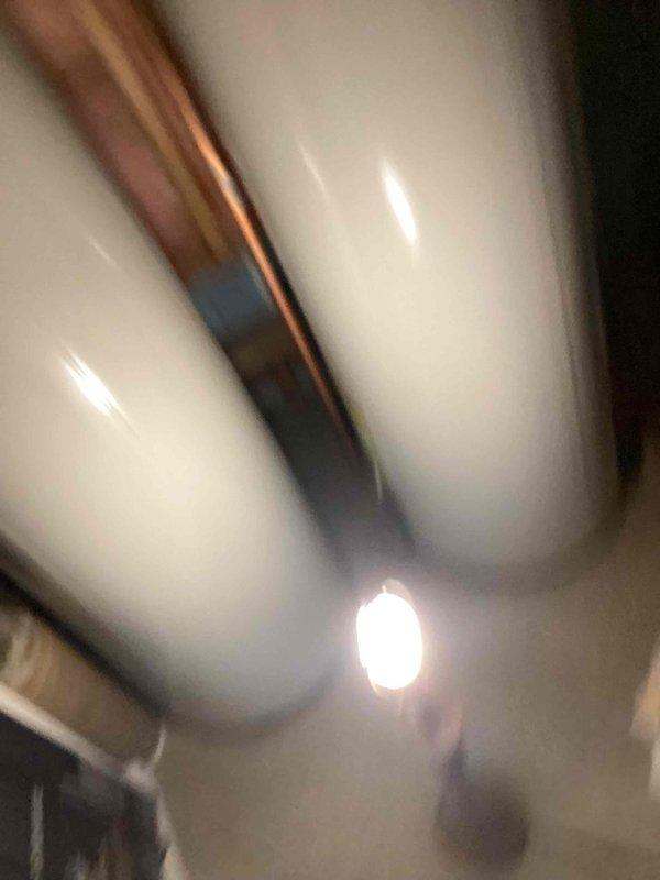 Responded to no cooling complaint on 19-year-old Carrier system. Upon arrival, performed complete system diagnostic including visual inspection of furnace, ductwork, and associated components in basement mechanical room. Evaluated air handler operation, checked refrigerant levels, and inspected condensate drainage system. Verified electrical connections and tested thermostat communication. Assessed overall system performance and identified service needs. Documented equipment condition through photographic evidence showing furnace unit with metallic supply ductwork and associated HVAC infrastructure. Provided customer with findings and recommended solutions to restore cooling functionality to the residential comfort system.