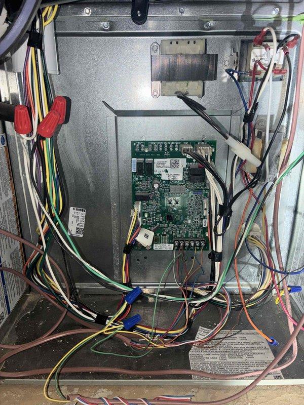 Completed comprehensive cooling system tune-up on two residential AC units, both approximately 10 years old and located on the side of the home. Performed full system inspection including control board diagnostics, electrical connection verification, and filter assessment. All wiring connections were found secure with proper color-coding and organization, control boards showed normal operation, and filters were evaluated for airflow efficiency.