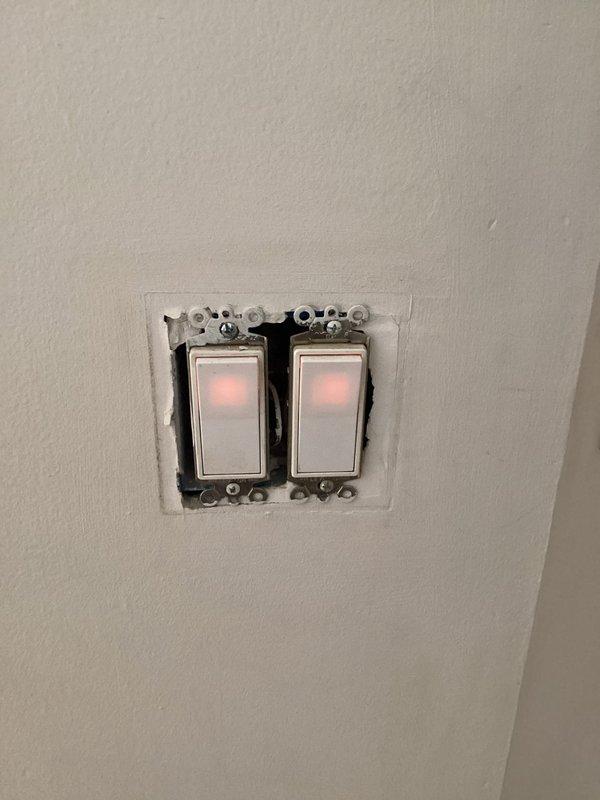 Responded to service call for non-functional ceiling fan and light fixture in living room. Upon inspection, identified issue with dual rocker switch controls and ceiling fan assembly with integrated frosted globe light fixture. Troubleshot electrical connections at wall switch box and fan motor housing to diagnose complete loss of power to both fan motor and lighting components. Restored functionality to five-blade ceiling fan unit and accompanying light fixture, verifying proper operation of both circuits through dual-gang switch controls.