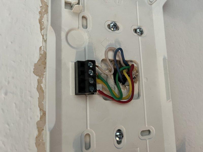 Responded to no-heat call for blank thermostat display on unit 10 located in hallway. Upon arrival, found iComfort thermostat with no power to display. Removed existing thermostat faceplate, inspected wiring connections at terminal block, and verified proper wire placement including R, Y, G, and W terminals. Reinstalled thermostat, restored power, and confirmed display functionality with touchscreen responding properly. System operational upon departure.